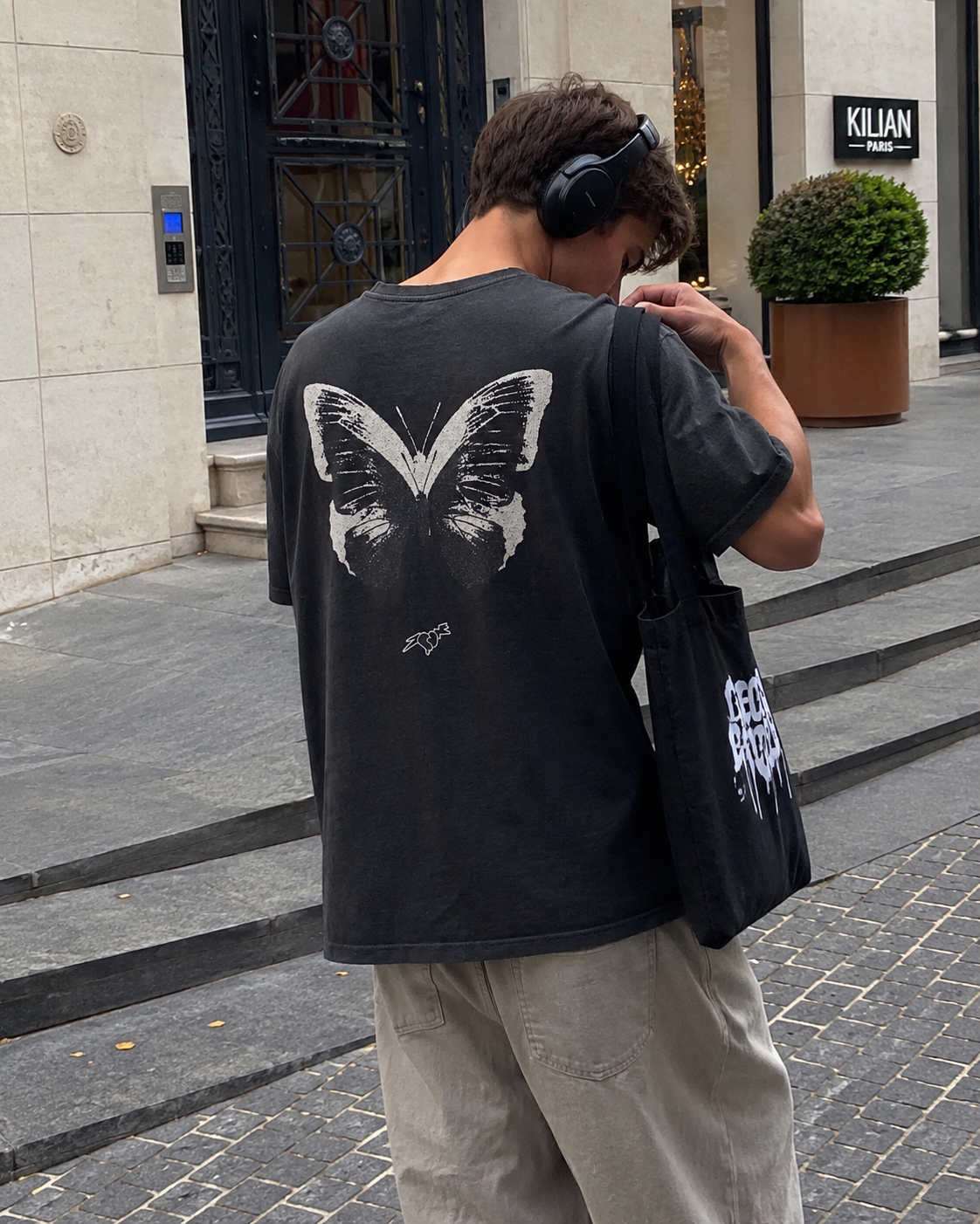 man in butterfly t-shirt